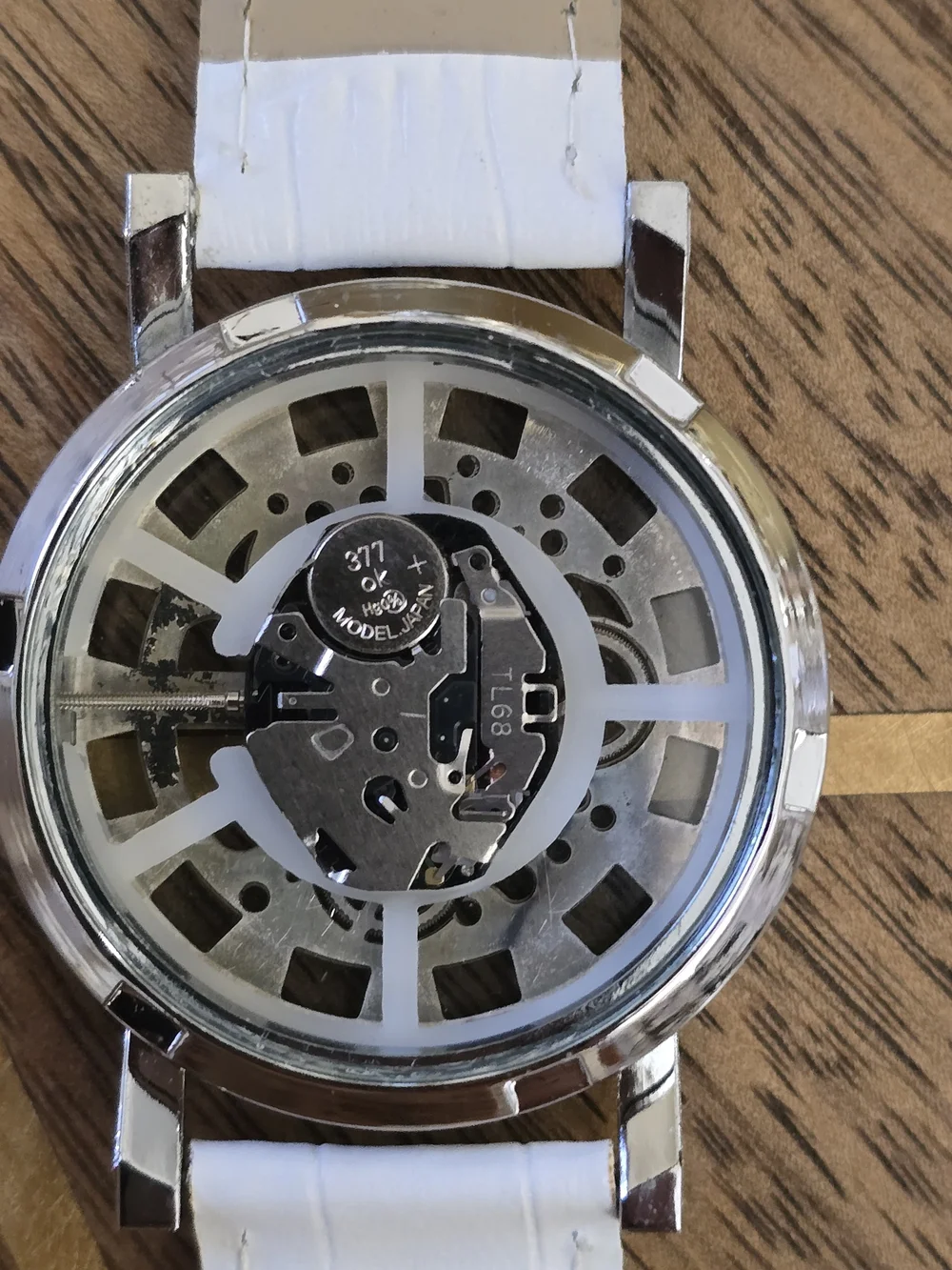 White Strap Silver-Tone Skeleton Mechanical Watch